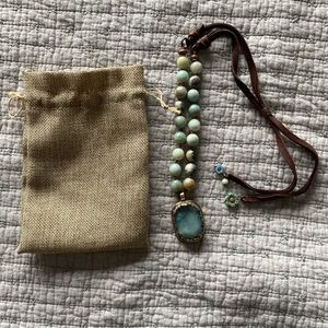 New, never worn stone and leather necklace
